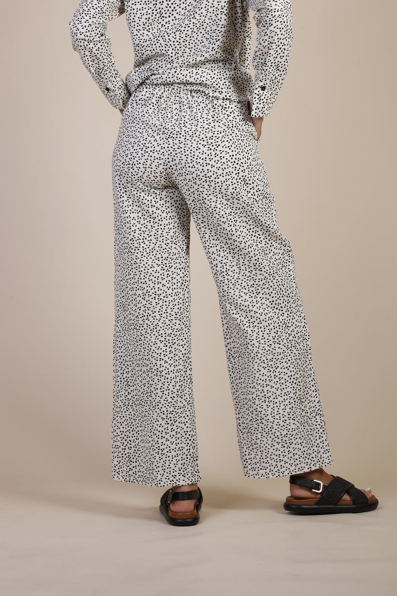 beige pant with black dots